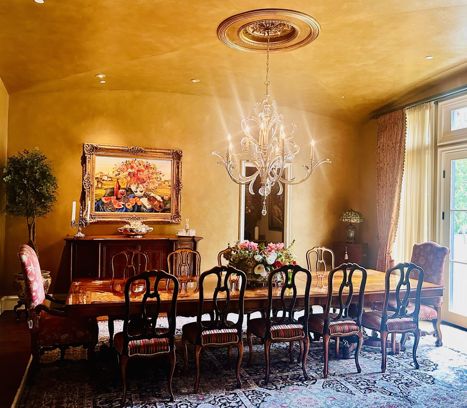 Grand dining room with a crystal chandelier, designed by Chateau Concepts