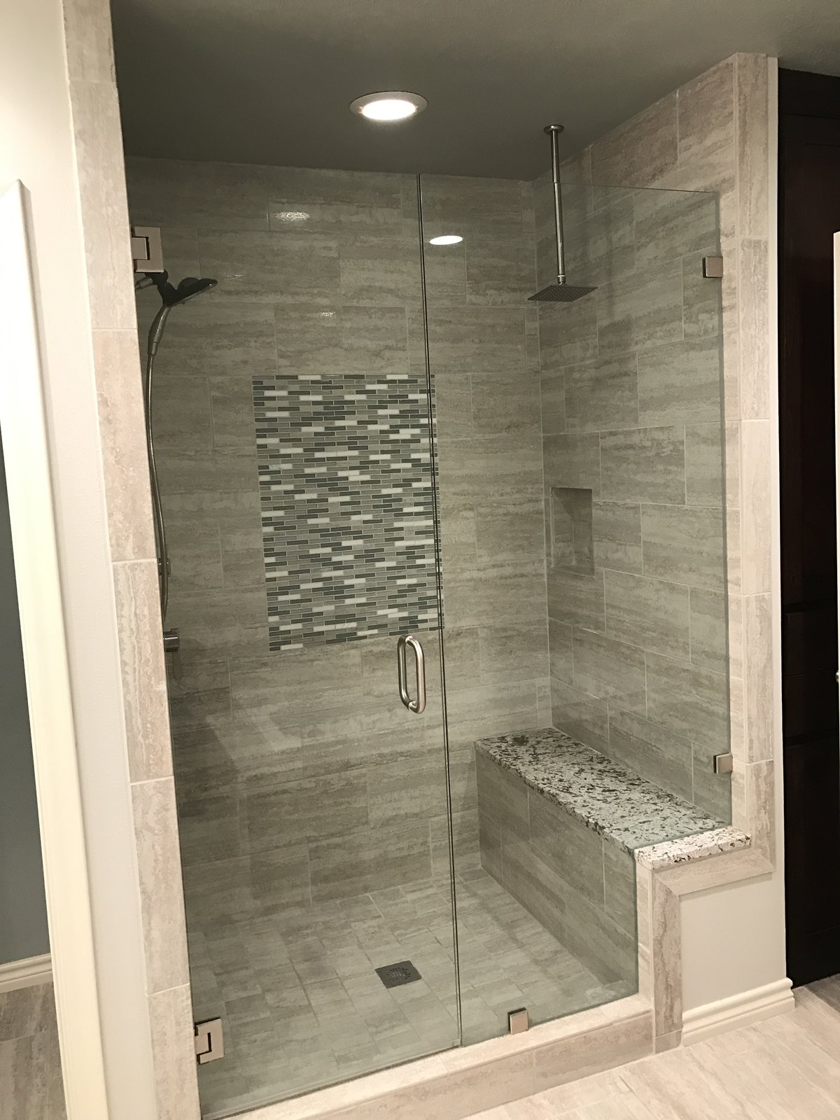 Newly tiled walk-in shower with mosaic band, built by Chateau Concepts in Dallas